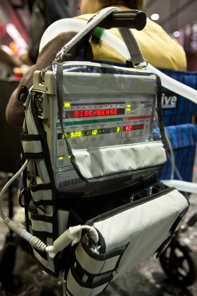 Amy Graves, who is quadriplegic and uses a wheelchair, depends on the Pulmonetic Systems LTV-950, a lightweight mobile ventilator, to breathe, Thursday, Feb. 5, 2014. Graves, who frequently visits Las Vegas throughout the year, was refused a seat on a return flight by Virgin Air because of her ventilator.